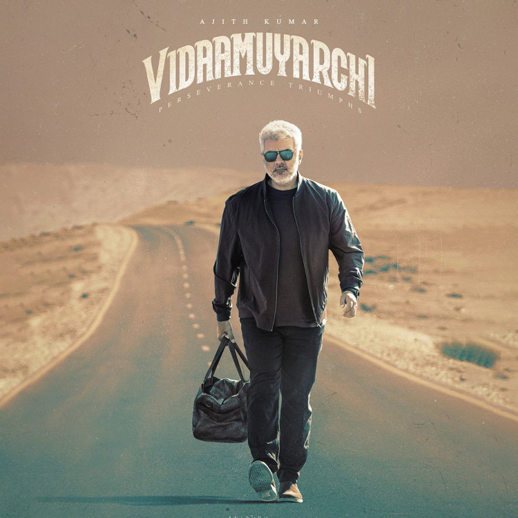 Ajith Kumar walking down a desolate road carrying a bag in the poster of VidaaMuyarchi.